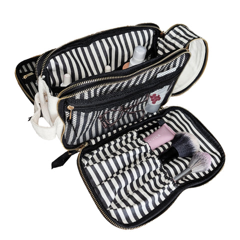 Triple Beauty and Toiletry Organizer in cream with three compartments holding makeup brushes and toiletries