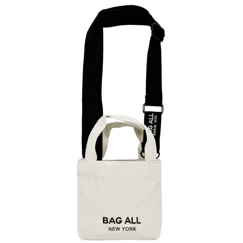 Bag-all Mini Tote Bag in cream cotton with adjustable black strap, interior pocket and New York logo, featuring dual handle design perfect for everyday essentials