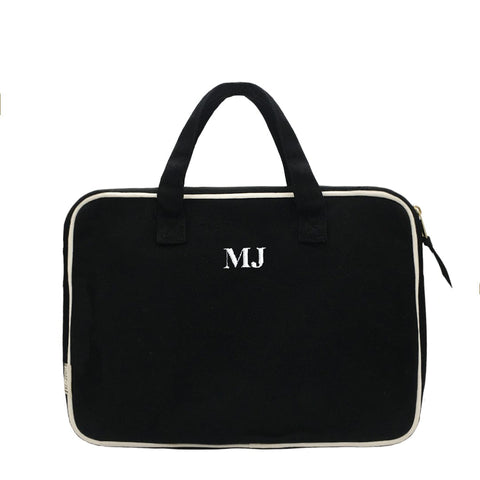 Bag-all Black Laptop Case 13" with handles and charger pocket, featuring white trim, monogram detail, padded protection and front storage compartment for accessories