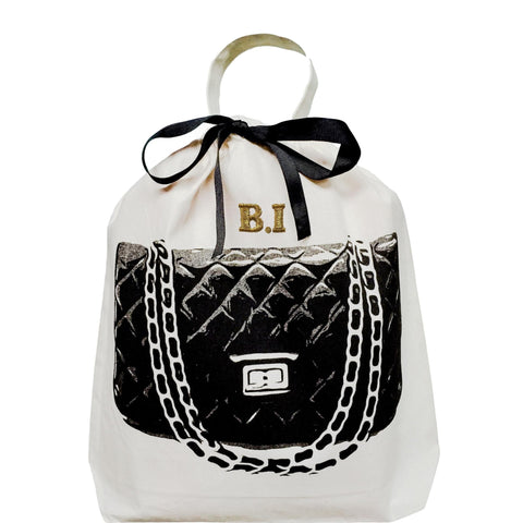 Bag-all Quilted Handbag Travel Bag in cream with black designer purse illustration, black ribbon bow, and personalized gold monogram, perfect for luxury handbag storage and protection