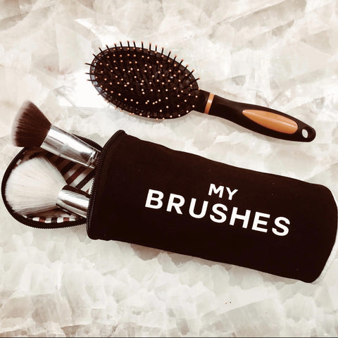 Bag-all Brushes Cylinder Case in Black with 'My Brushes' text, shown with makeup brushes and hair brush, perfect for organizing beauty tools