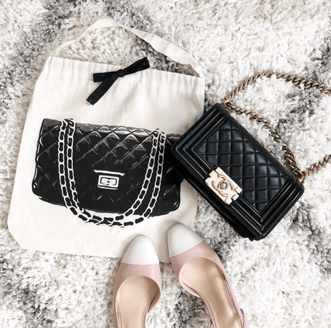 Bag-all Quilted Handbag Travel Bag in Cream featuring artistic purse design, displayed with luxury quilted black handbag and stylish two-tone flats on plush white carpet
