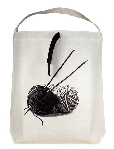 Bag-all Cream Knitting Bag featuring black and white yarn ball print with knitting needles, portable canvas tote with handle for organizing craft supplies