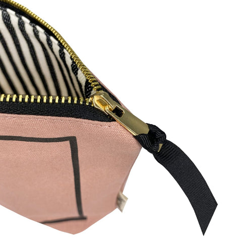 Bag-all Passport Pouch in blush pink cotton with gold zipper, striped lining and black ribbon pull. Stylish travel organizer for documents and cards.