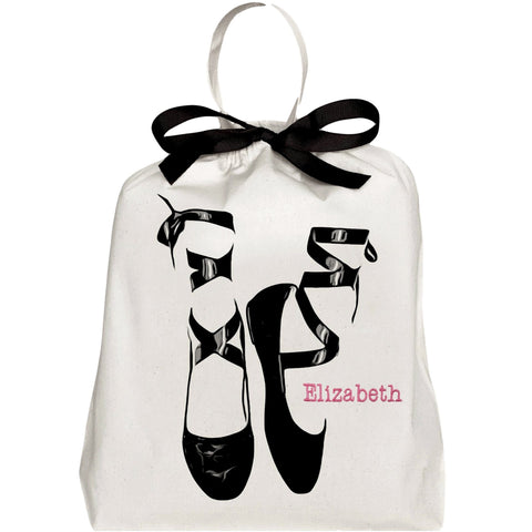 Bag-all Pointe Ballerina Shoe Bag in cream cotton with black ballet shoe design, black ribbon tie, and customizable name embroidery in pink, perfect for storing dance shoes