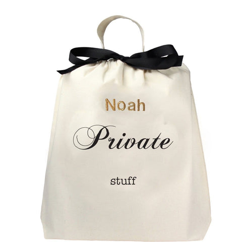 Bag-all Private Stuff Large Bag in cream cotton with black bow, personalized with 'Noah', featuring elegant script text and hanging loop for storage and organization