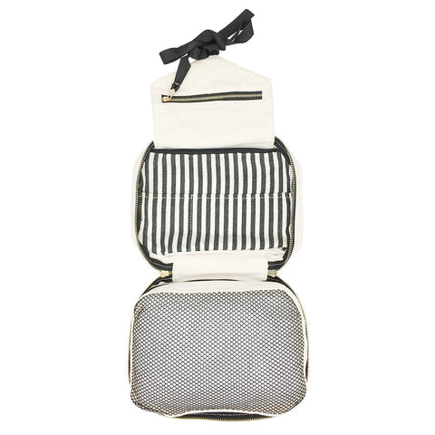 Bag-all Folding/Hanging Toiletry Case in cream with three compartments - striped interior, mesh pocket, and hanging ribbon. Multi-functional travel organizer with zippered sections for toiletries.