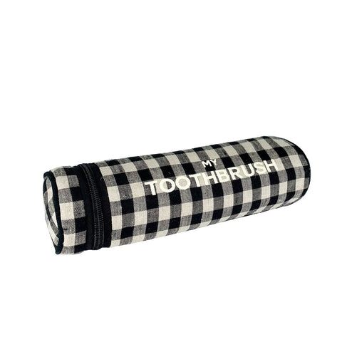 Bag-all Toothbrush Travel Case in black and white gingham pattern with stylish text print, featuring zipper closure and water-resistant lining for dental care organization