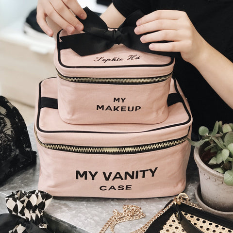 Bag-all Ultimate Gift Set featuring pink cotton makeup and vanity cases with black bow detail, perfect for travel and home organization