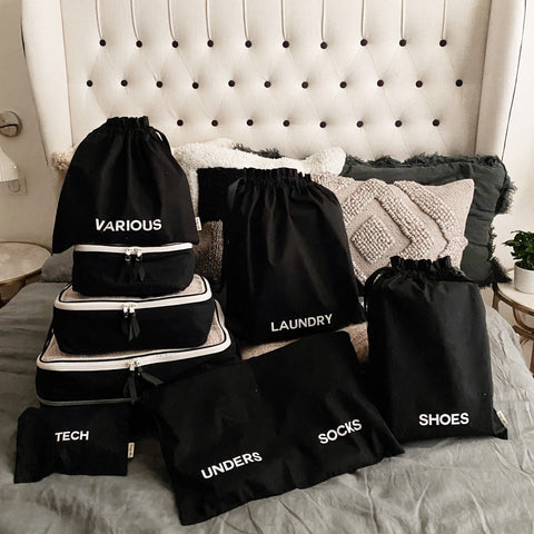 Bag-all BA Travel Set, 8-Pack in Black. Stylish packing organizers including laundry, shoes, socks, tech, and various pouches for travel