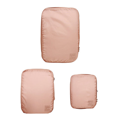 Bag-all Recycled Nylon Compression Packing Cubes in Pink/Blush, 3-piece set with space-saving design. Eco-friendly travel organizers made from repurposed plastic bottles.