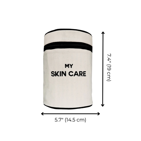 Bag-all Round My Skin Care Case in cream, cylindrical organizer with black trim and text, featuring laminated lining and internal pockets for beauty products