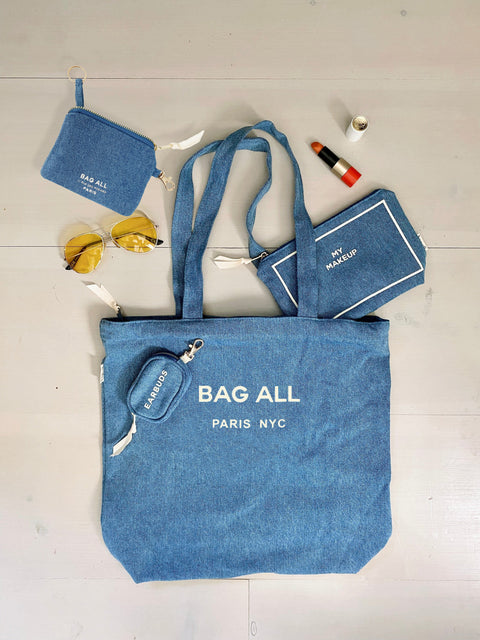 Denim New York City tote bag with zipper, inside pocket, and matching small accessories for daily use