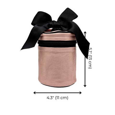 Pink blush round travel liquids case with black bow, dimensions 4.3 by 5.1 inches, monogram option included