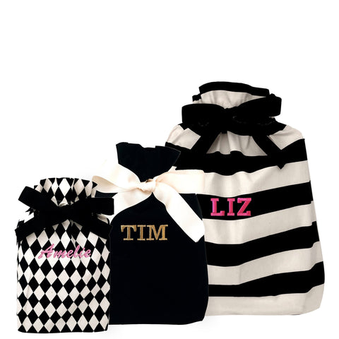 Bag-all Gift Bags Set Mix 1: Black and white patterned reusable fabric gift bags featuring diamond, solid, and striped designs with personalized monogram options and elegant ribbon ties