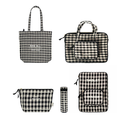 Bag-all Gingham Packing Set featuring 5 coordinating pieces in black and white check pattern: laptop case, makeup pouch, zipper tote, tablet case, and toothbrush holder with monogram options