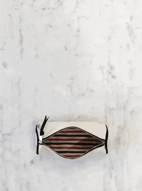 Bag-all Cream Pencil Case with striped interior lining, waterproof material, and zippered closure, perfect for organizing school and office supplies