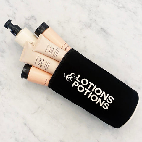 Bag-all Lotions & Potions black travel case with cream-colored toiletry bottles, waterproof cotton organizer for bathroom essentials and skincare products