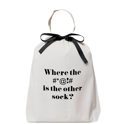 Bag-all Where the #*@!# Sock Bag in cream cotton with black text and bow, perfect for organizing missing socks and preventing sock loss