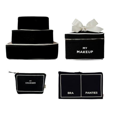 Black personalized travel organizer set with makeup, lingerie, tech, and packing cubes in natural cotton design