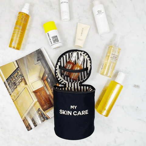 Bag-all Round Skin Care Case with Handle in black, shown open with skincare products, featuring striped interior lining, mesh pocket, and "MY SKIN CARE" text on cylindrical organizer
