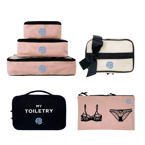 Bag-all Weekend Travel Gift Bundle 4-set featuring pink packing cubes, toiletry case, lingerie bag and makeup pouch with monogram details and black trim for stylish travel organization
