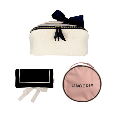 Bag-all Everyday Glam Makeup, Jewelry & Lingerie 3-set featuring cream makeup case with black bow, black jewelry roll, and pink round lingerie organizer for stylish storage and travel