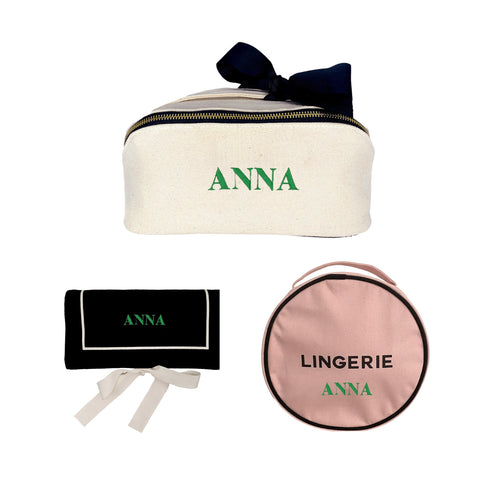 Bag-all Everyday Glam 3-set featuring cream makeup case with navy bow, black jewelry roll, and pink lingerie organizer with elegant zip closures and personalized text