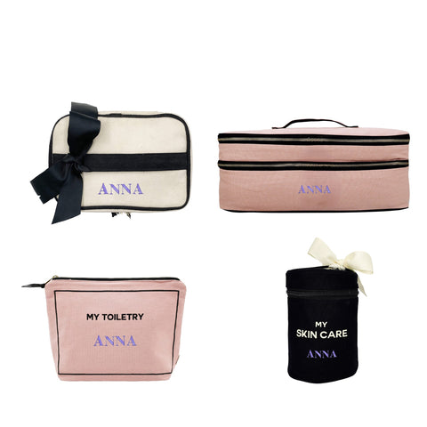 Bag-all Gift Set for the Beauty Lover 4-piece collection featuring blush pink and cream organizer bags with black trim, personalized with 'Anna' text, includes toiletry case, skincare holder, and travel pouches