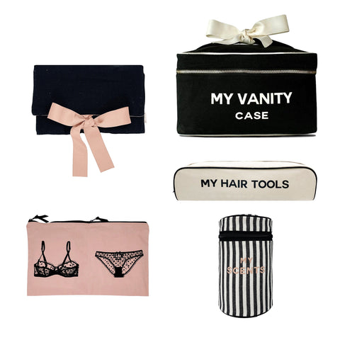 Bag-all Spoil Her Gift Bundle Deal 5-set featuring elegant organizing cases: black jewelry roll, vanity case, hair tools bag, lingerie pouch, and striped secrets case with decorative bows