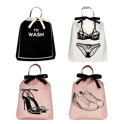 Bag-all Travel Light 4-pack for Her featuring organized bags for lingerie, shoes, sneakers and laundry in black, white and pink with stylish black bow details and iconic prints