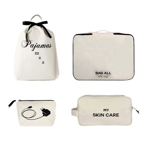 Bag-all Essentials Getaway 4-Pack featuring natural cotton organizers: pajama bag with bow, travel packing cube, charger pouch, and skincare case in cream with black text embroidery