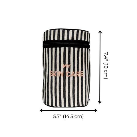 Bag-all Round My Skin Care Case in black and white stripes with rose gold text, featuring cylindrical design and secure elastic band closure. Travel-sized organizer.