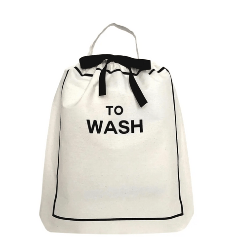 Bag-all To Wash Laundry Bag in cream with black trim, featuring drawstring closure and carrying handle. Stylish organizer for dirty clothes with bold text print.