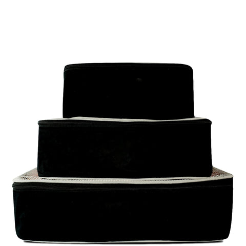 Bag-all Weekend Essential Packing Set 4-Pack in black cotton featuring stackable packing cubes with white trim, perfect for organized travel and weekend getaways