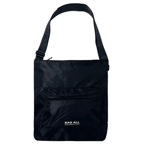 Bag-all City Backpack/Tote in black recycled nylon, featuring convertible straps, padded laptop protection, front zipper pocket and striped interior lining. Versatile New York design.